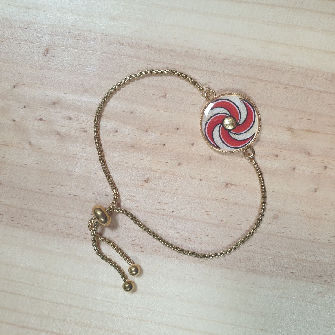 Bracelet réglable enluminure spirale bleue ou rouge et or
