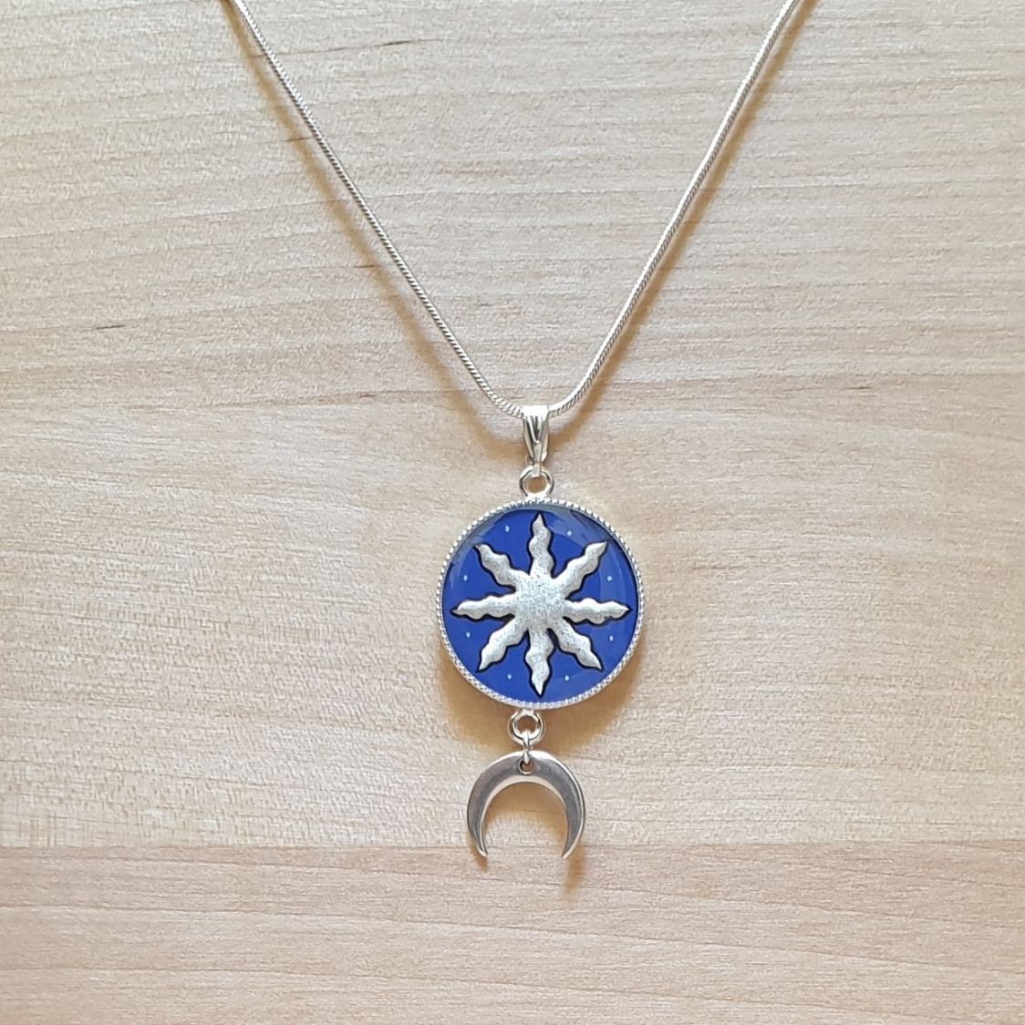 Collier pendentif soleil/étoile d'or blanc