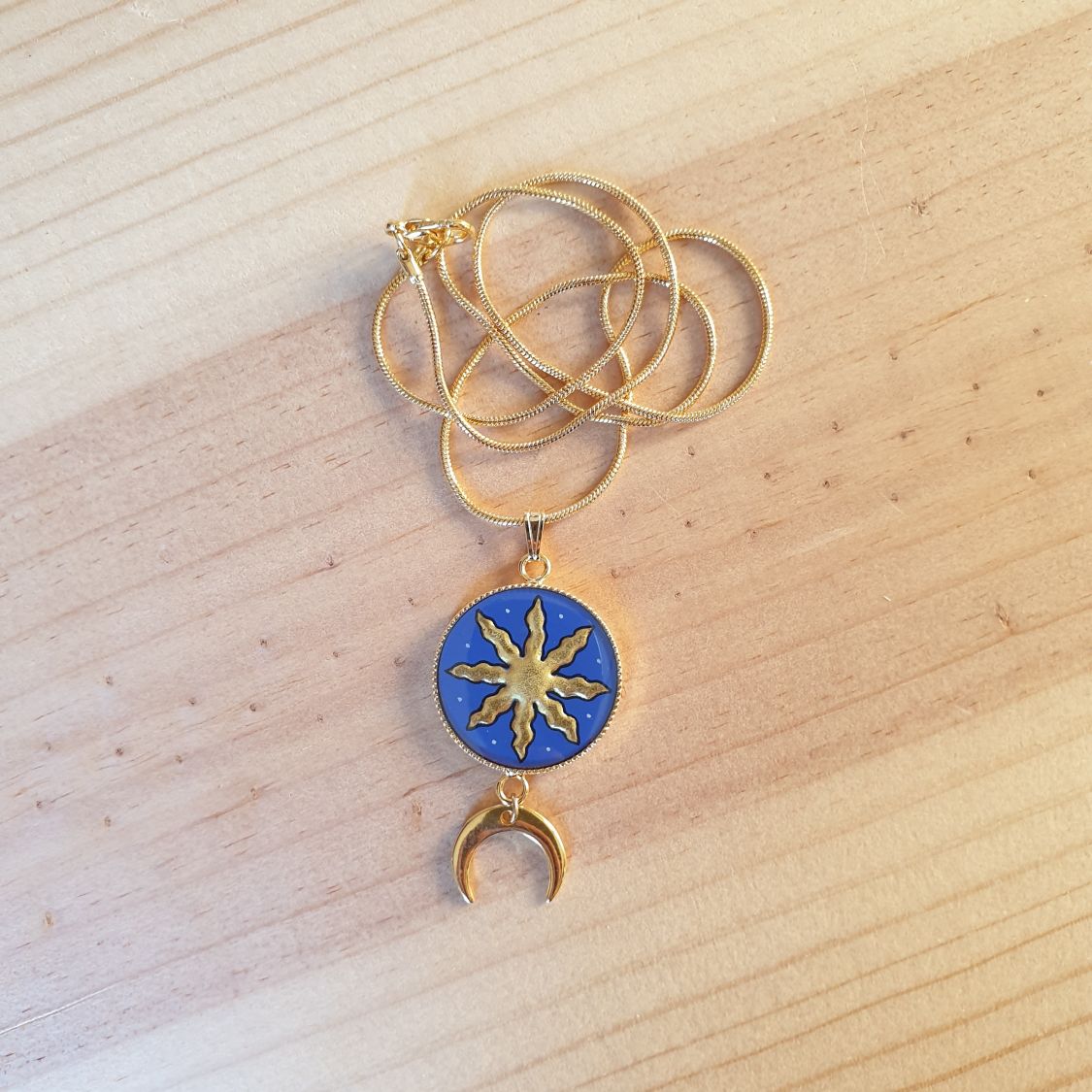 Collier pendentif soleil/étoile d'or